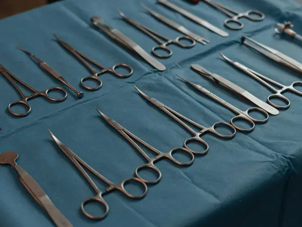 Illustration: surgical instruments on a sterile tray.